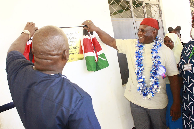 Kilifi North MP Owen Baya (right) unveils a plaque for the renovation of nine classrooms at Basi Primary school on Thursday, January 25, 2024.