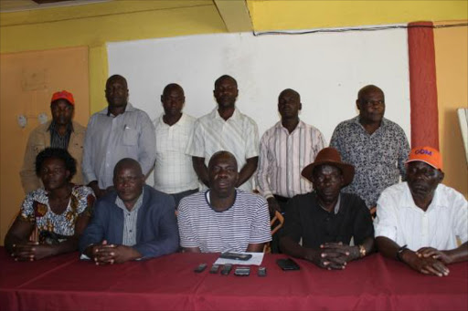 Migori county ODM officials led by County Organising secretary Joseph Nyambori (in stripped T-shirt), the interim County Chair Phesto Ogwada (blue coat) during a press conference, May 26, 2017. /MAURICE ALAL.