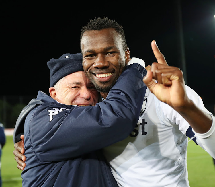 Bidvest Wits chairman Brain Joffe and defender Bongani Khumalo celebrate after winning an Absa Premiership match. Khumalo has since left the club.