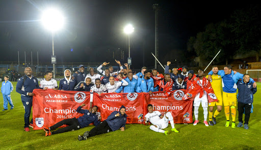 Bidvest Wits' playing squad celebrate after being crowned the 2016/17 PSL champions after the Absa Premiership match against Polokwane City at Bidvest Stadium on May 17, 2017 in Johannesburg, South Africa.