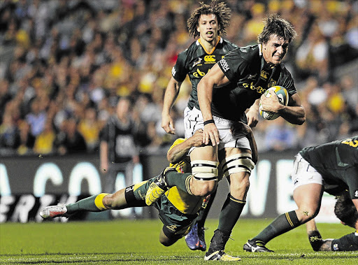 Young Springbok lock Eben Etzebeth, with the ball, was cited and goes on "trial" today before a disciplinary committee, charged with attempting to head-butt veteran Wallaby lock Nathan Sharpe during Saturday's Four Nations test in Perth Picture: REUTERS