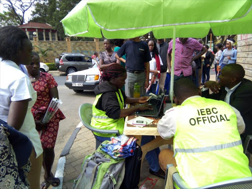 Members of the public queue to register as voters ahead of the August 8 general election. /COURTESY