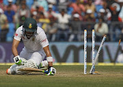 South Africa's Faf du Plessis sits after he was bowled out by India's Amit Mishra during the third day of their third test cricket match in Nagpur, India. Picture credits: Reuters