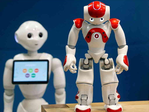 SoftBank Robotics Robot Assistants Pepper (L) and NAO (R) are pictured in Paris, France, March 9, 2018. Picture taken March 9, 2018. /REUTERS