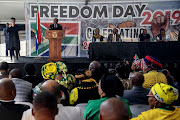 South African President Cyril Ramaphosa addresses the crowd gathered at the Miki Yili Stadium, ahead of the celebrations for the 25th anniversary of Freedom Day, in Makhanda, Eastern Cape Province on April 27, 2019. 