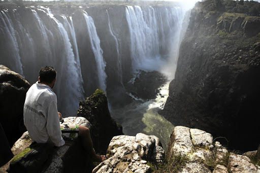 Workers at lodges in Victoria Falls, one of Zimbabwe's top tourist attractions, have been warned to self-isolate after a UK tourist tested positive for the coronavirus.