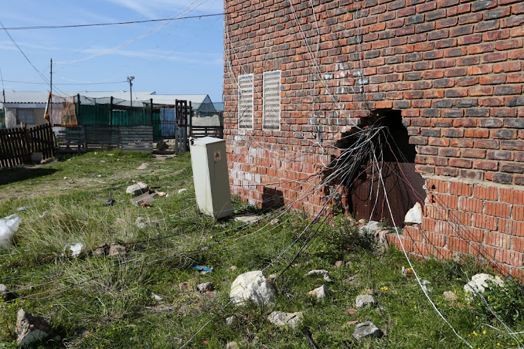 These illegal connections are at a substation in Avro Street in the Airport Valley informal settlement. Bricks have been removed to provide easy access for the connections. There are also live wires running across the road.