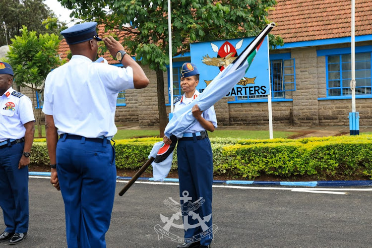 Major General Fatuma Ahmed receives the KAF flag from her predecesor and new VCDF Lieutenant General John Omenda during the change of guard at the Kenya Air Force Headquarters in Nairobi, May 9, 2024.