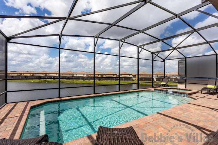 Kissimmee villa with a lake view from the west-facing pool deck