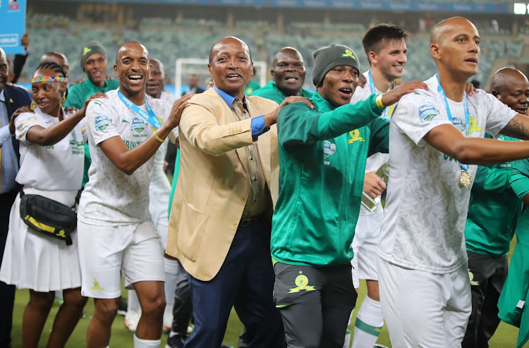 Mamelodi Sundowns players celebrate with their president and billionaire-owner Patrice Motsepe.