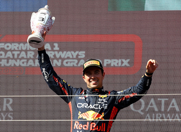 Red Bull's Sergio Perez celebrates on the podium after finishing third in the Hungarian Grand Prix. Picture: REUTERS