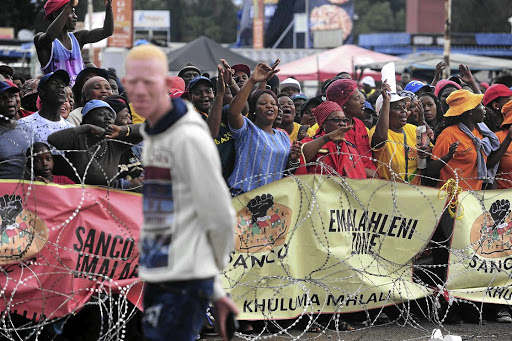 Sympathisers sing in support of the Shabane family whose daughter Gabisile, who had albinism, was murdered along with her 15-month-old cousin Nkosikhona Ngwenya.