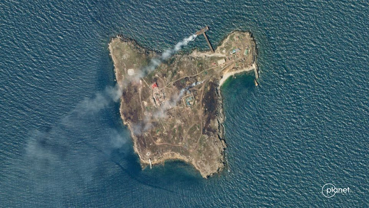 A satellite image shows smoke rising from Snake Island, off the coast of Ukraine, June 29, 2022.