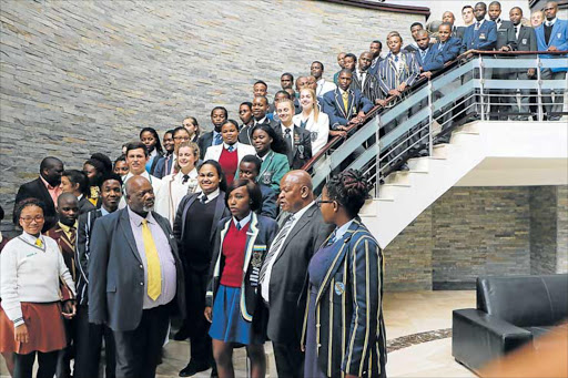 FUTURE HOPE: Top achievers met Education MEC Mandla Makupula, right, and his deputy director-general Themba Kojana at the East London ICC yesterday PICTURE: MICHAEL PINYANA