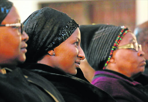 DEEPLY LOVED: A memorial service for former Daily Dispatch journalist Simpiwe Piliso was held in the city yesterday. Piliso’s wife Sange smiles as colleagues, friends and family remember the good times Picture: ALAN EASON