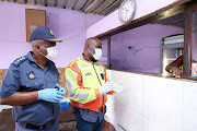 KZN police commissioner Gen Khombinkosi Jula and MEC for transport, community safety and liaison Bheki Ntuli visit a tavern in Shaka’s Head, north of Durban, on Thursday 