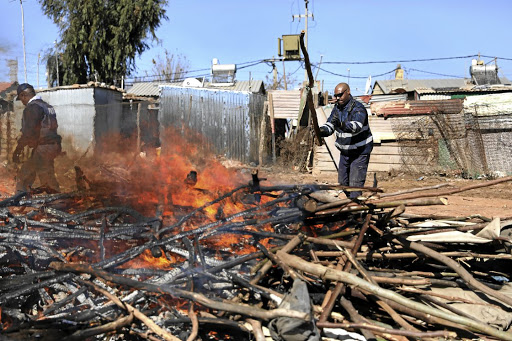 SAPS and the JMPD in this file picture are destroying illegal mining equipment near Roodepoort. The police have arrested 20 illigal miners on Tuesday.