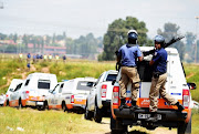 Johannesburg Metro Police Department (JMPD) officers demolish illegal shacks and stop land invasion by squatters from Mzimhlophe on March 13, 2017 in Soweto, South Africa. The squatters said they had erected the shacks so they can have some shelter. 
