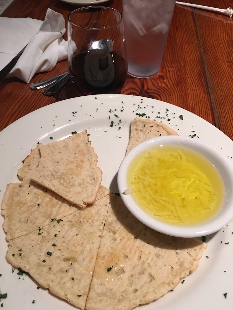 Gluten free flat bread with an olive oil and Parmesan cheese "dip"