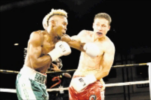 BORING: Zolani Marali fights Gamali Diaz of Mexico on thier IBO Junior Light Weight Title at Emperors Palace in Johannesburg. 03/04/2009. Pic. Antonio Muchave. © Sowetan.