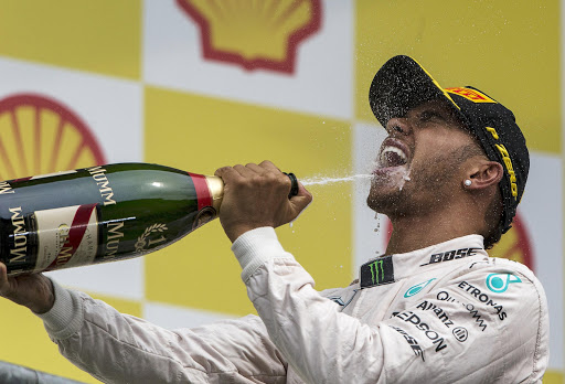 Mercedes Formula One driver Lewis Hamilton of Britain celebrates his victory in the Belgian F1 Grand Prix in Spa-Francorchamps August 23, 2015. REUTERS/Stringer TPX IMAGES OF THE DAY