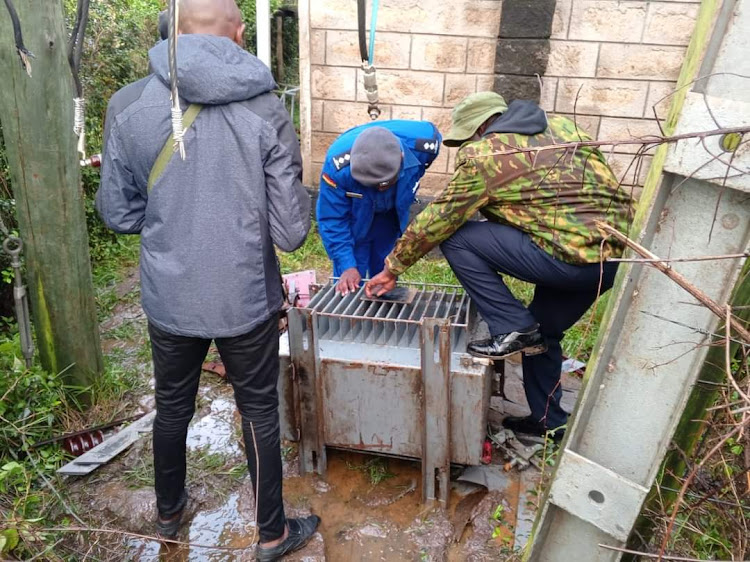 Police officers process the scene where a transformer was vandalised at Tala in Matungulu, Machakos County on April 13, 2024/ HANDOUT