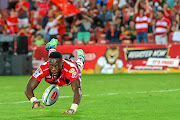 Madosh Tambwe of the Lions scores his fourth try during the Super Rugby match against the  Stormers at Emirates Airline Park in Johannesburg.