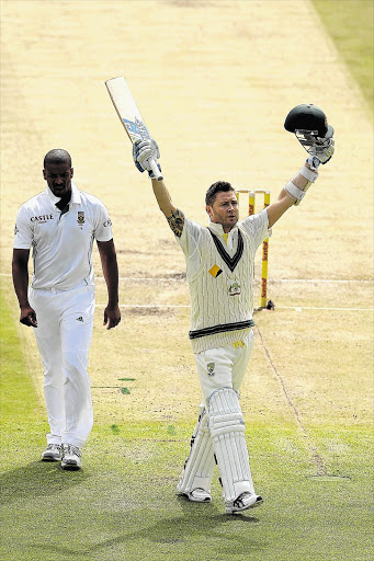 POWERHOUSE: The Proteas' Vernon Philander, left, looks on as Michael Clarke of Australia celebrates his century