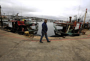 Lionell Brown would rather be at sea, but the legal stand-off over fishing rights has kept his trawlers in harbour instead of fishing for hake.