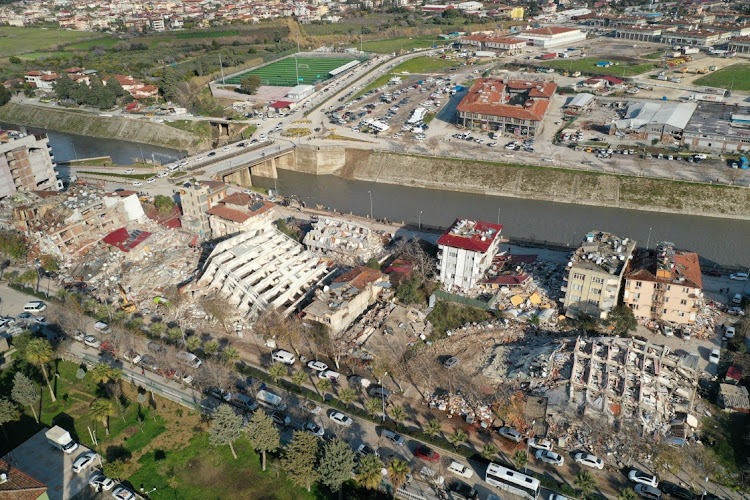 An aerial view shows damaged and collapsed buildings following an earthquake, in Hatay, Turkey.