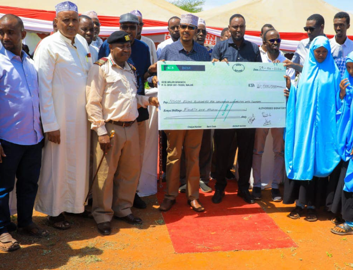 Eldas MP Adan Keynan [C] and school heads during the unveiling of bursary funds from the government CDF kitty.