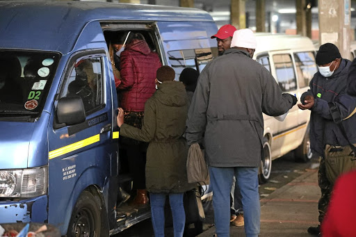 Taxi commuters at Baragwanath Taxi Rank, in Soweto, where taxis are operating at full capacity./ANTONIO MUCHAVE