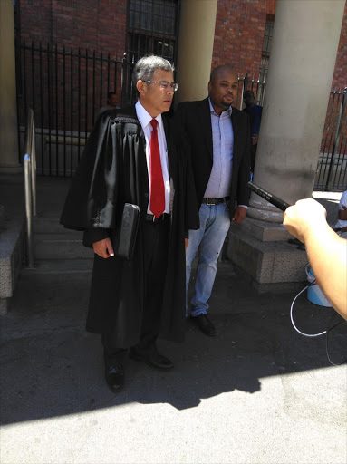 Hlumelo Biko with his lawyer‚ Roy Barends‚ outside Cape Town Magistrate’s Court on Thursday. Image: Philani Nombembe