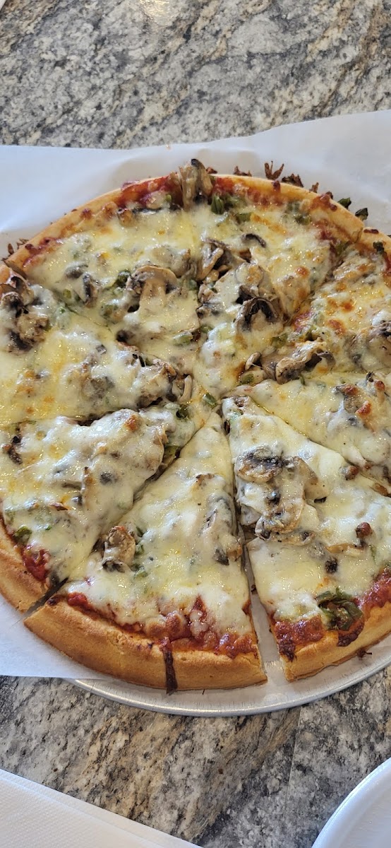 Pizza with green peppers and mushrooms