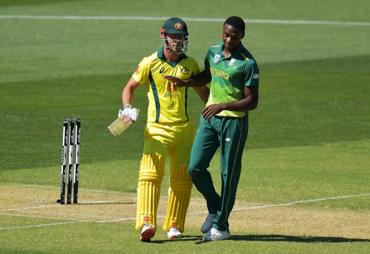 Chris Lynn of Australia and Kagiso Rabada of South Africa react during game two of the One Day International series between Australia and South Africa at Adelaide Oval on November 9, 2018 in Adelaide, Australia.