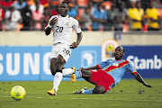 Ghana's Kwadwo Asamoah avoids a tackle by Alain Kaluyituka Dioko of DR Congo on Sunday Picture: RICHARD HUGGARD/GALLO IMAGES