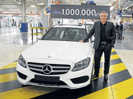 IT’S A MILLION: MBSA chief executive Arno van der Merwe with the C-Class that marks the one-millionth Mercedes manufactured in the East London plant’s 57-year history Picture: SUPPLIED
