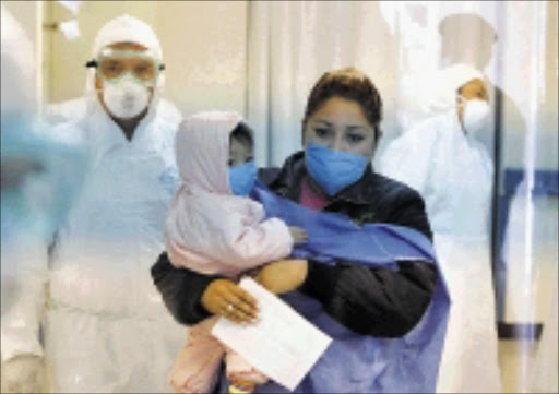 MEDICINE MASKS: Wearing protective face masks, a woman and her child leave the emergency centre at the naval hospital in Mexico City where people with swine flu-life symptoms are checked. 29/04/2009. Pic. Eduardo Verdugo. © AP.