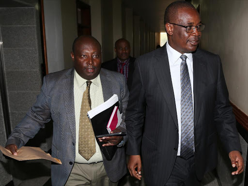 Nairobi county governmet chief of staff George Wainaina and Nairobi governor Evans Kidero after appearing before a senate public accounts and investments committee on December 15.Photo/HEZRON NJOROGE