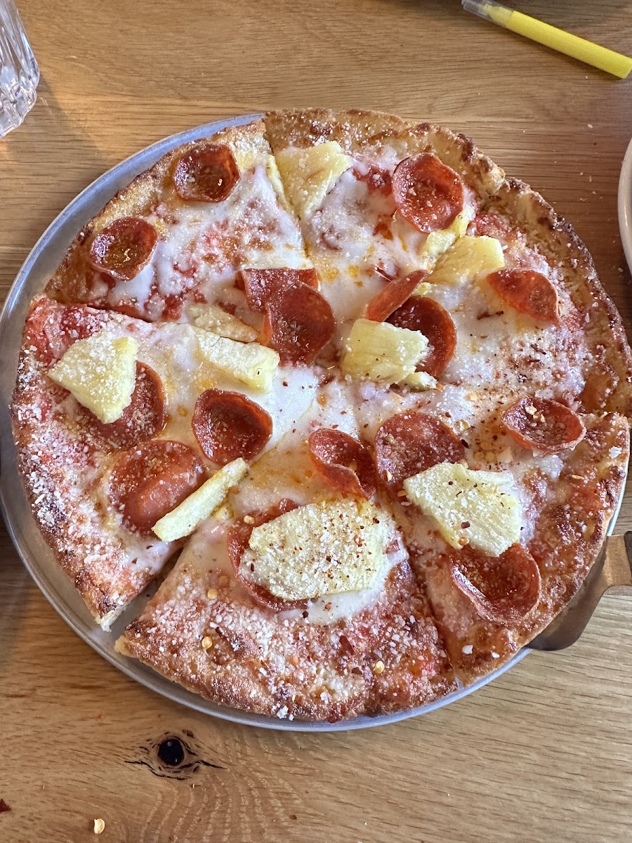 Gluten free pizza with pepperoni and pineapple