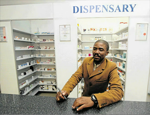 SERVICE AT LAST: Pharmacist Vumile Mzinzi at his Ithalomso Pharmacy , the first pharmacy to be opened at Mount Fletcher since the town was established more than a century ago. Picture: LULAMILE FENI