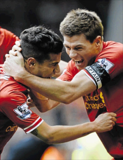 the kop boys: Liverpool's Philippe Coutinho, left, celebrates with Steven Gerrard after a win