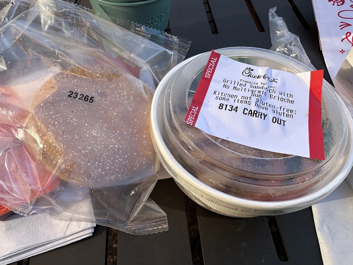 Chicken breast with lettuce and tomato in a container marked "special" and a sealed GF bun. A sauce packet was provided with the sandwich which i confirmed was Gf via their website.