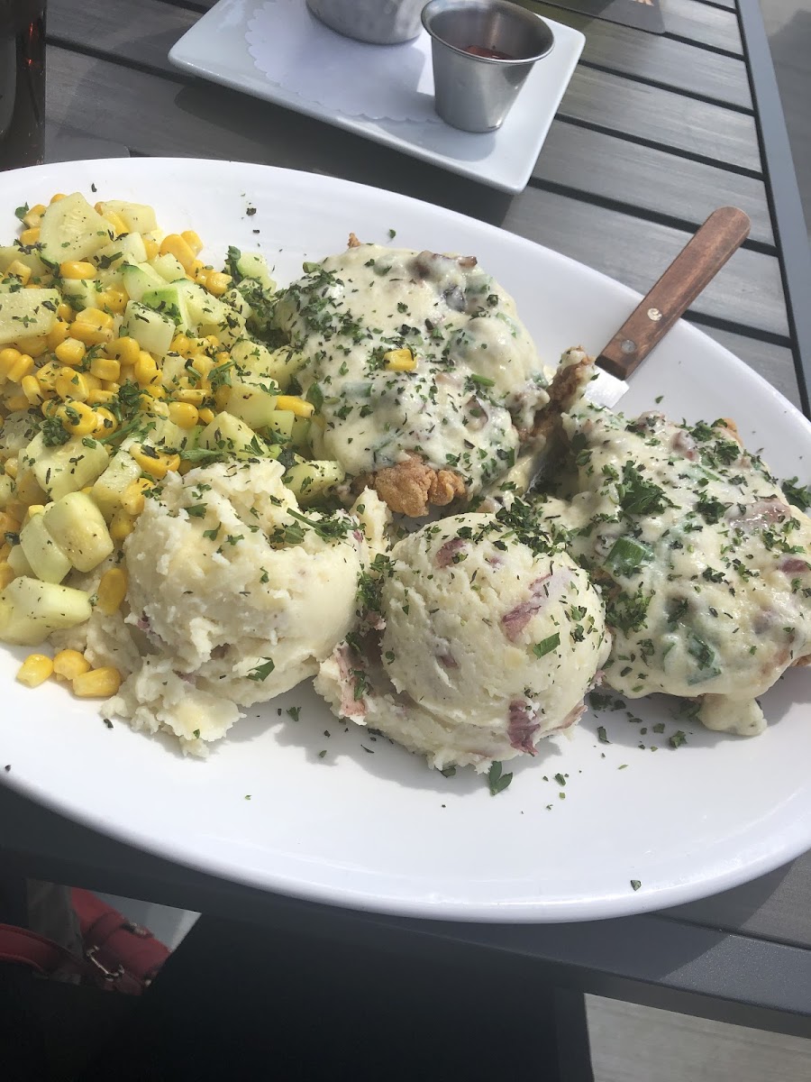 fried chicken dinner with asiago potatoes and sweet corn with zucchini