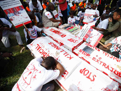 Lawyers and civil society members protest on July 4, with caskets symbolising the murder of lawyer Willie Kimani, boda boda rider Josephat Mwendwa and taxi driver Joseph Muiruri. /JACK OWUOR