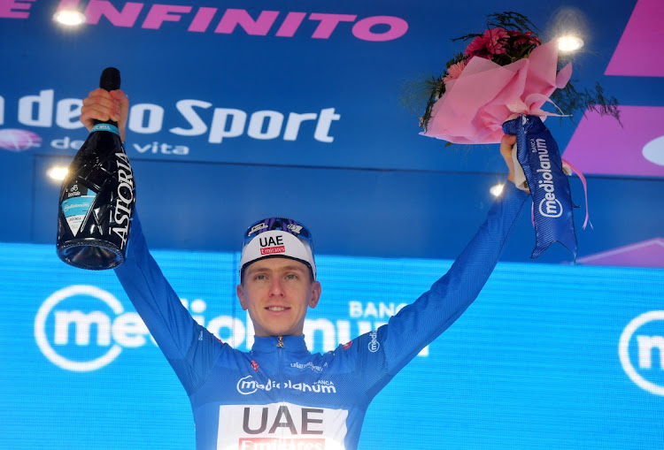 Movistar Team’s Pelayo Sanchez celebrates on the podium after winning stage 6 of the Giro d'Italia in Italy, May 9 2024. Picture: REUTERS/JENNIFER LORENZINI