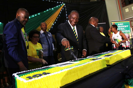 MANY HAPPY RETURNS: ANC president Cyril Ramaphosa cuts the cake as ANC general secretary Ace Magashule and Jessie Duarte look on at the 106th birthday celebration held in East London Picture: MICHAEL PINYANA