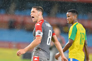 Themba Zwane and Dean Furman react during the Absa Premiership match between Mamelodi Sundowns and SuperSport United at Loftus Versfeld Stadium on April 13, 2017 in Pretoria, South Africa.