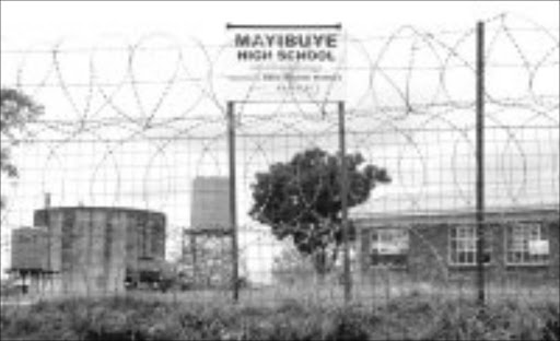 BARRED: Mayibuye High School where a grade 12 pupil allegedly shot a cop. Pic. Riot Hlatshwayo. 16/10/07, © Sowetan.