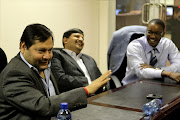 Indian businessmen Ajay and Atul Gupta, and Sahara director, Duduzane Zuma at the New Age Newspaper's offices in Midrand, Johannesburg, South Africa on 4 March 2011.